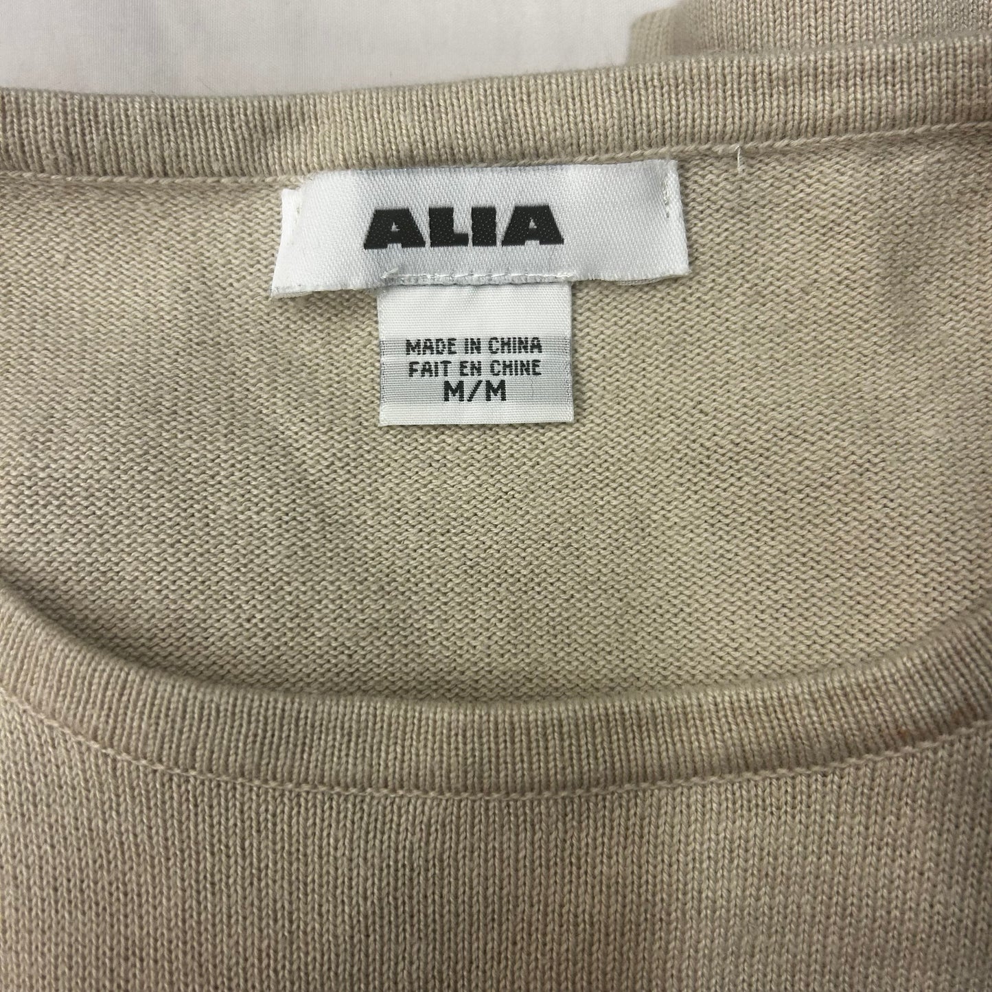 Beige top with flower detail