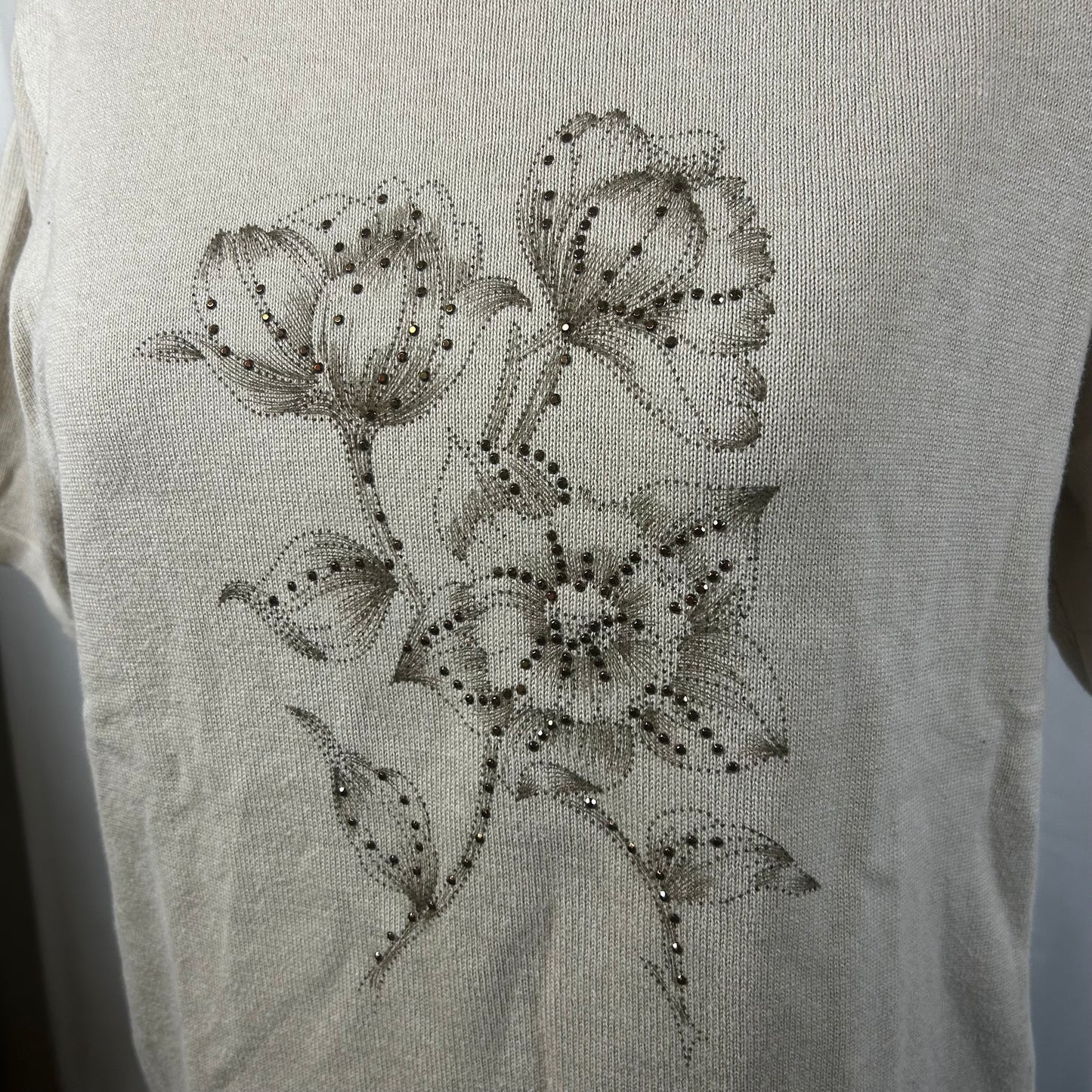 Beige top with flower detail